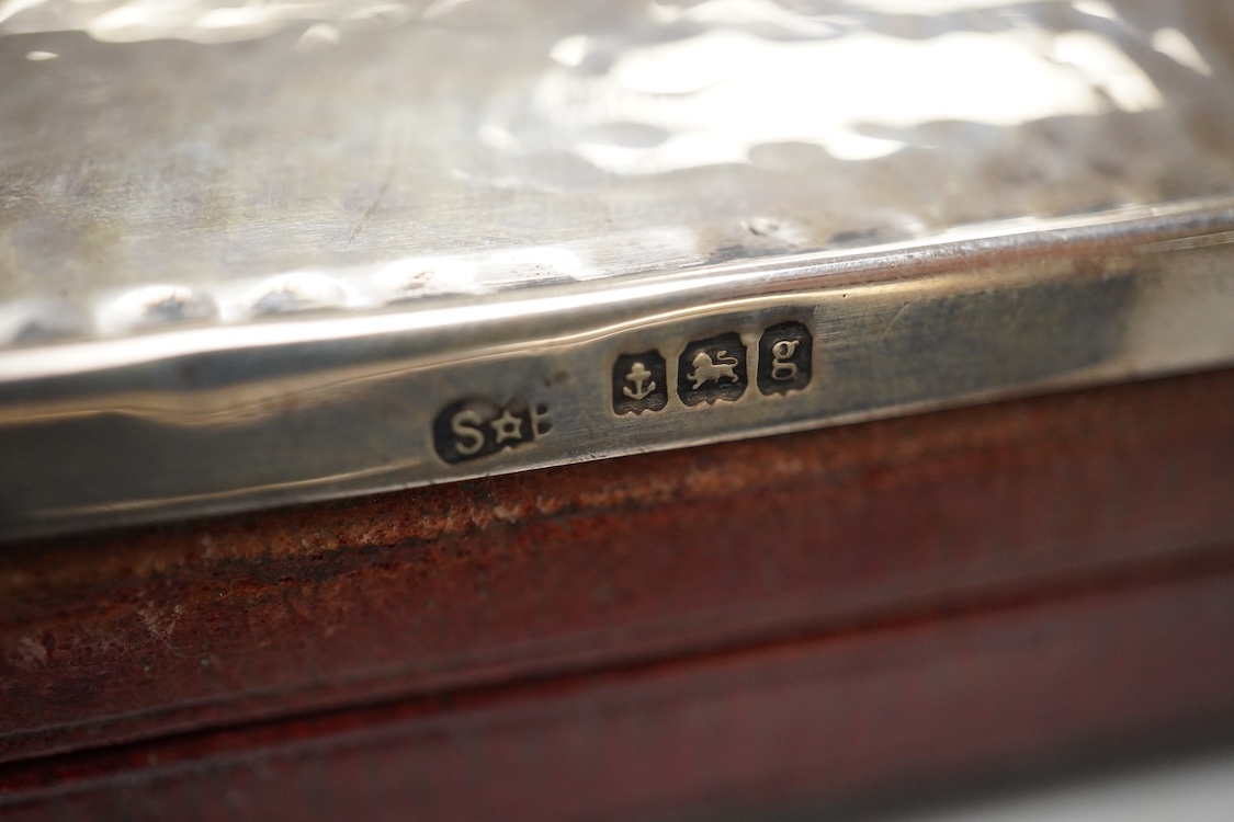 Two Edwardian silver mounted leather travelling watch cases, Chester 1905 and Birmingham, 1907, both containing a chrome cased keyless pocket watch.